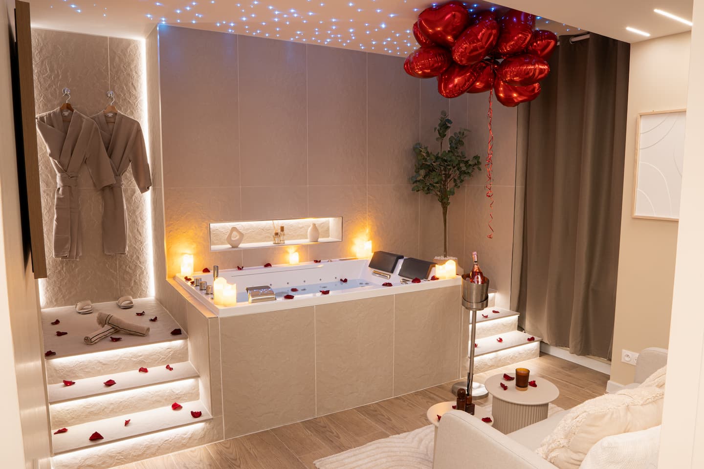 Alcohol-free champagne, rose petals, candles, heart balloon.